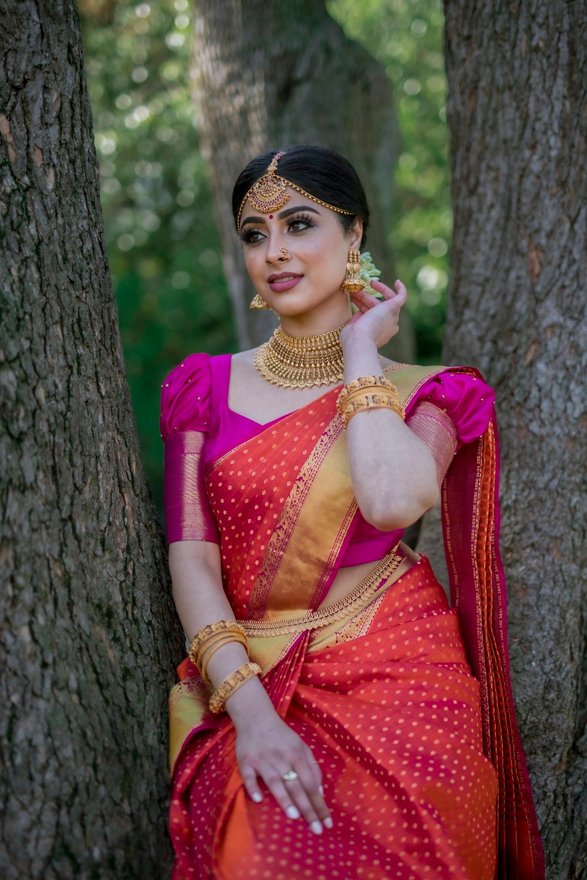 Woman in a red and blue saree