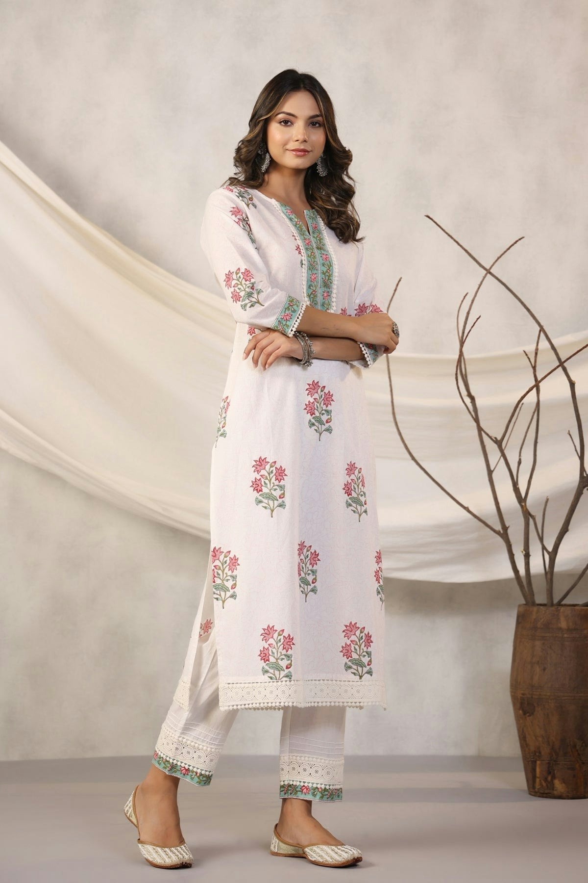 Woman in a white floral kurta pajama set