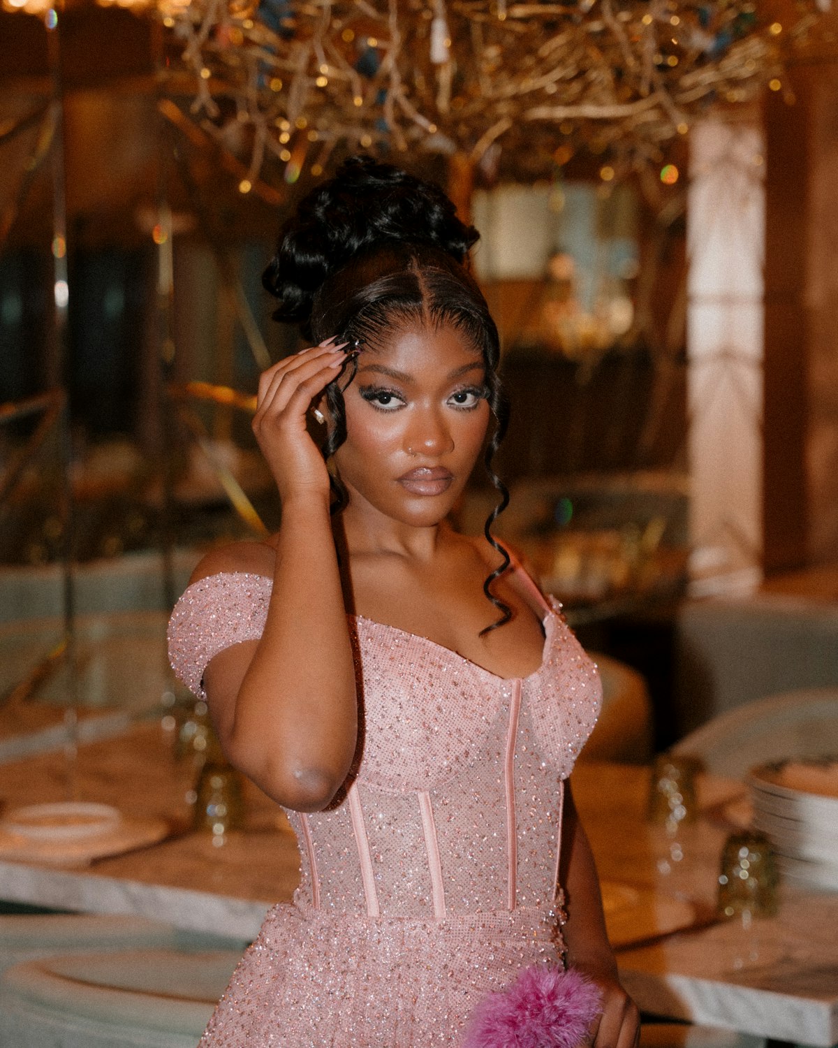 Young woman in a sparkly pink dress
