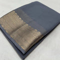 Vaystra Crepe Chit Pallu Solid Saree With Unstitched Blouse 5.5Mtr – Grey